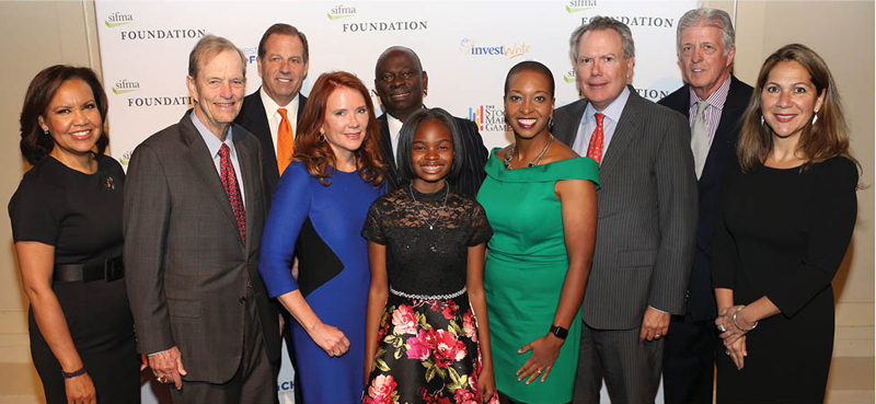 The SIFMA Foundation honored champions of Financial literacy - Tom James of Raymond James and Charlotte McLaughlin of PNC Capital Markets - at the 2019 Tribute Dinner in New York City.