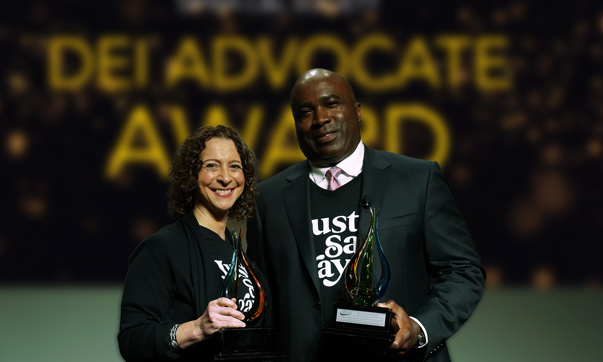 Jacqueline LiCalzi, Morgan Stanley and Chris Lewis, Edward Jones accept the inaugural DE&I Advocate Award